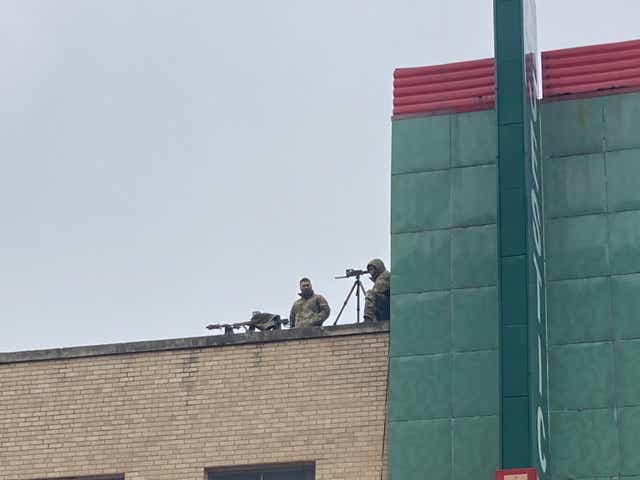<p>Snipers watch over a parade in Brownsville, Texas, on 26 February, 2022.</p>