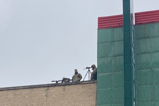 <p>Snipers watch over a parade in Brownsville, Texas, on 26 February, 2022.</p>