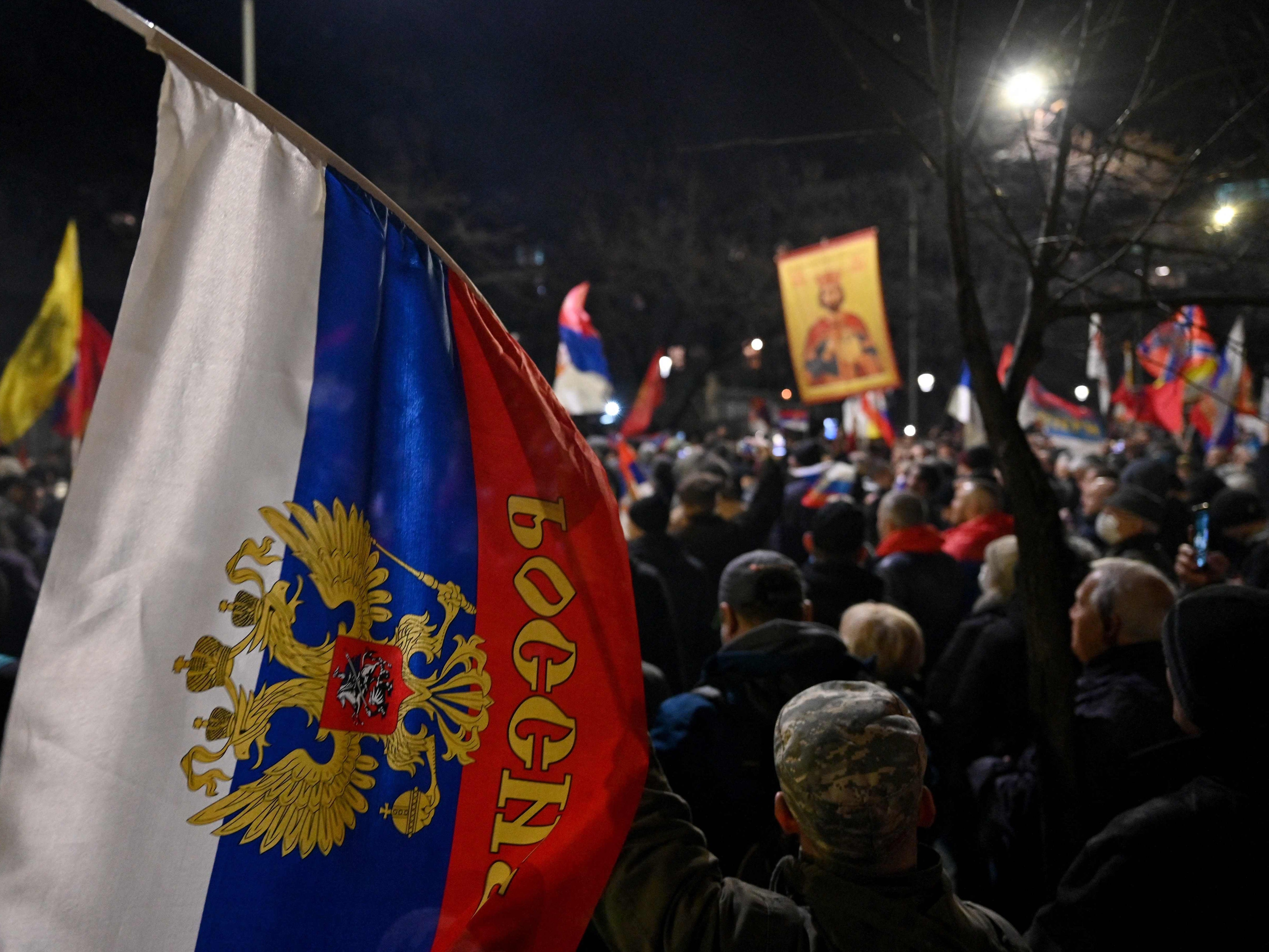 People wave Russian and Serbian flags during a rally organised by Serbian right-wing organisations in support of Russian invasion in Ukraine, in Belgrade earlier this month