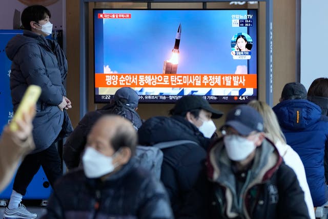 <p>File: People watch a TV showing a file image of North Korea’s missile launch during a news programme at the Seoul Railway Station in South Korea </p>