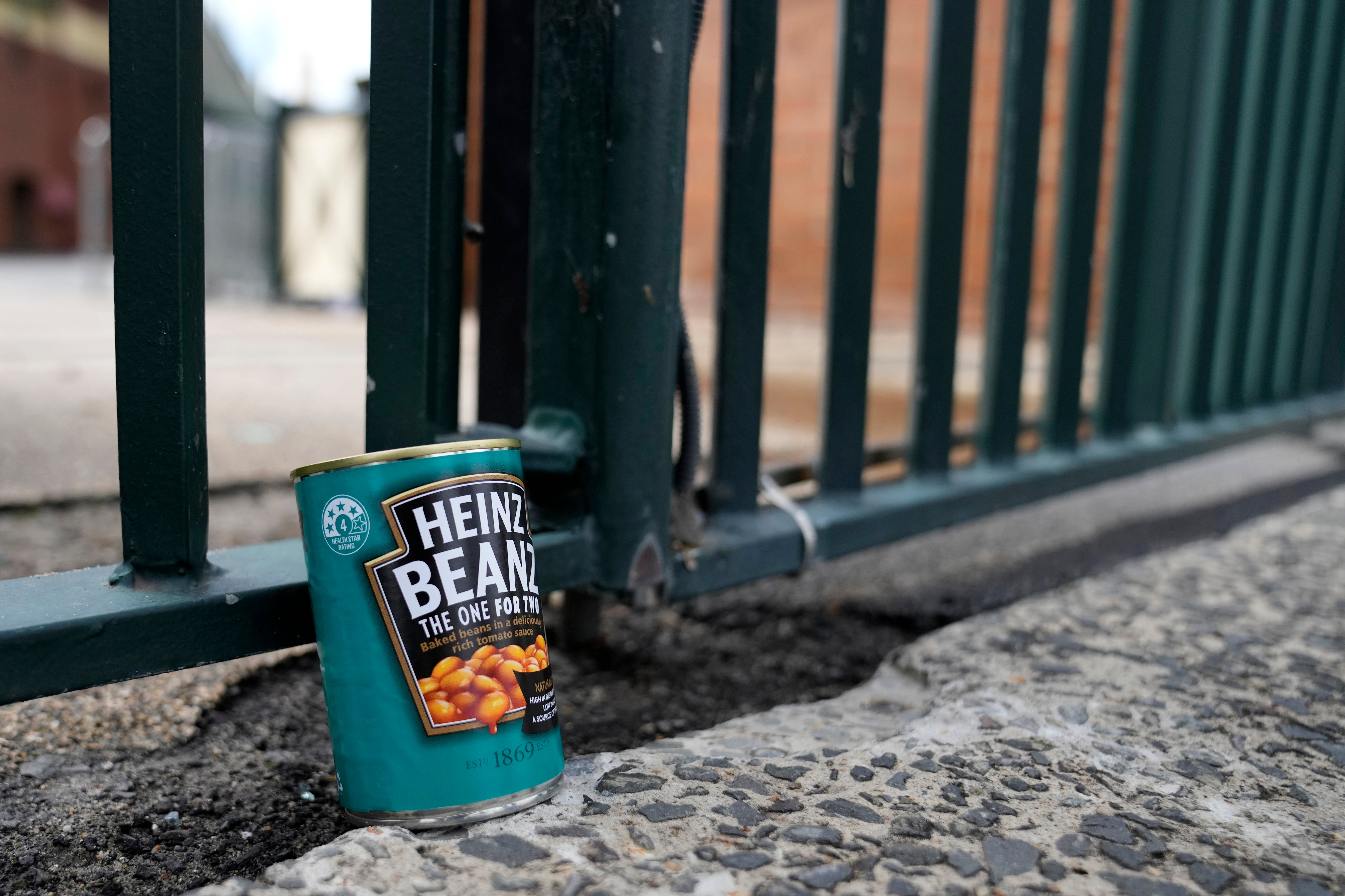 A can of baked beans is left at the gates at the Sydney Cricket Ground as tribute to Warne, who was renowned for eating the food while on tour (AP Photo/Rick Rycroft)