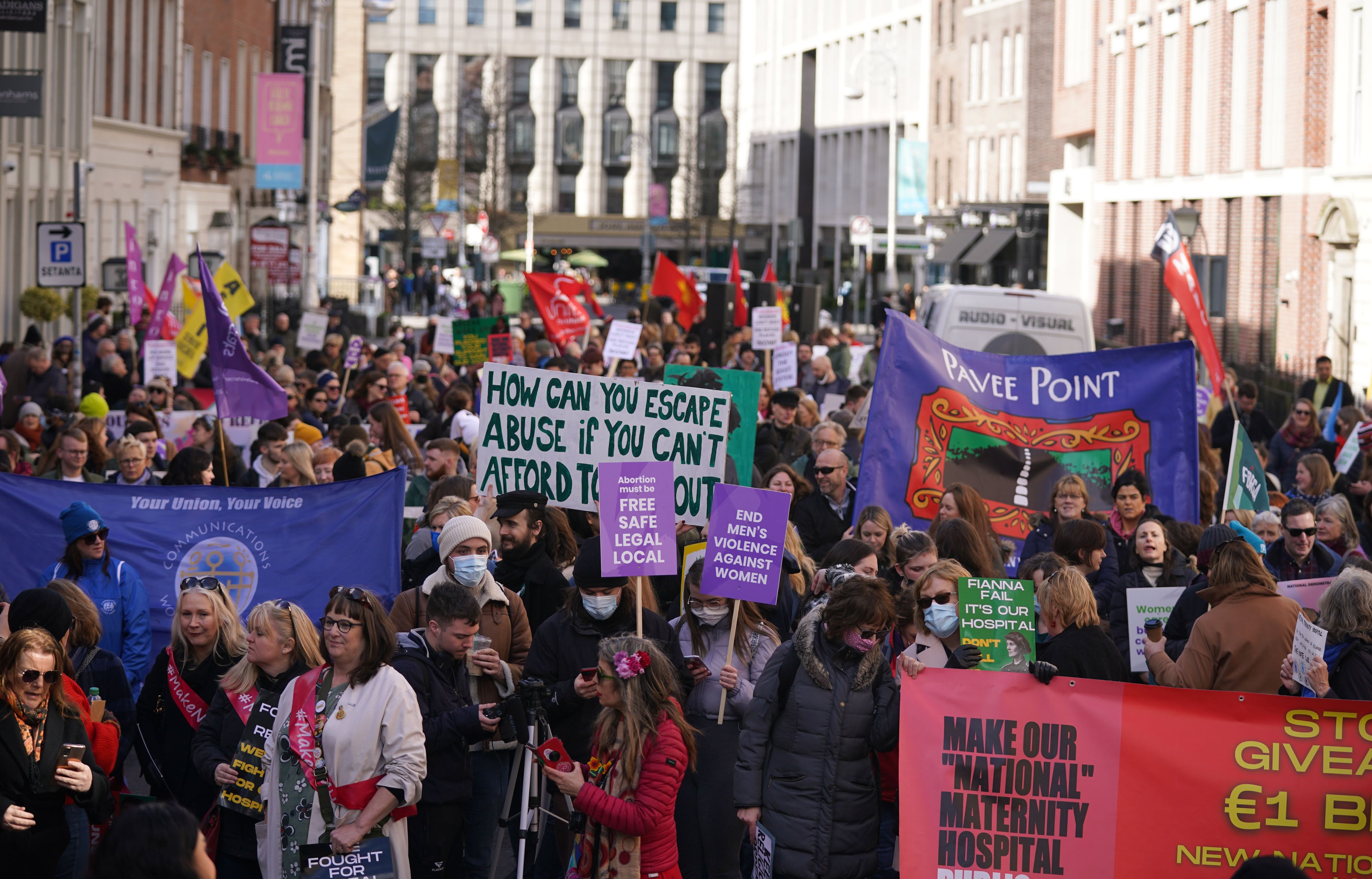 People take part in a National Women’s Council of Ireland rally outside Leinster house in Dublin (Niall Carson/PA)