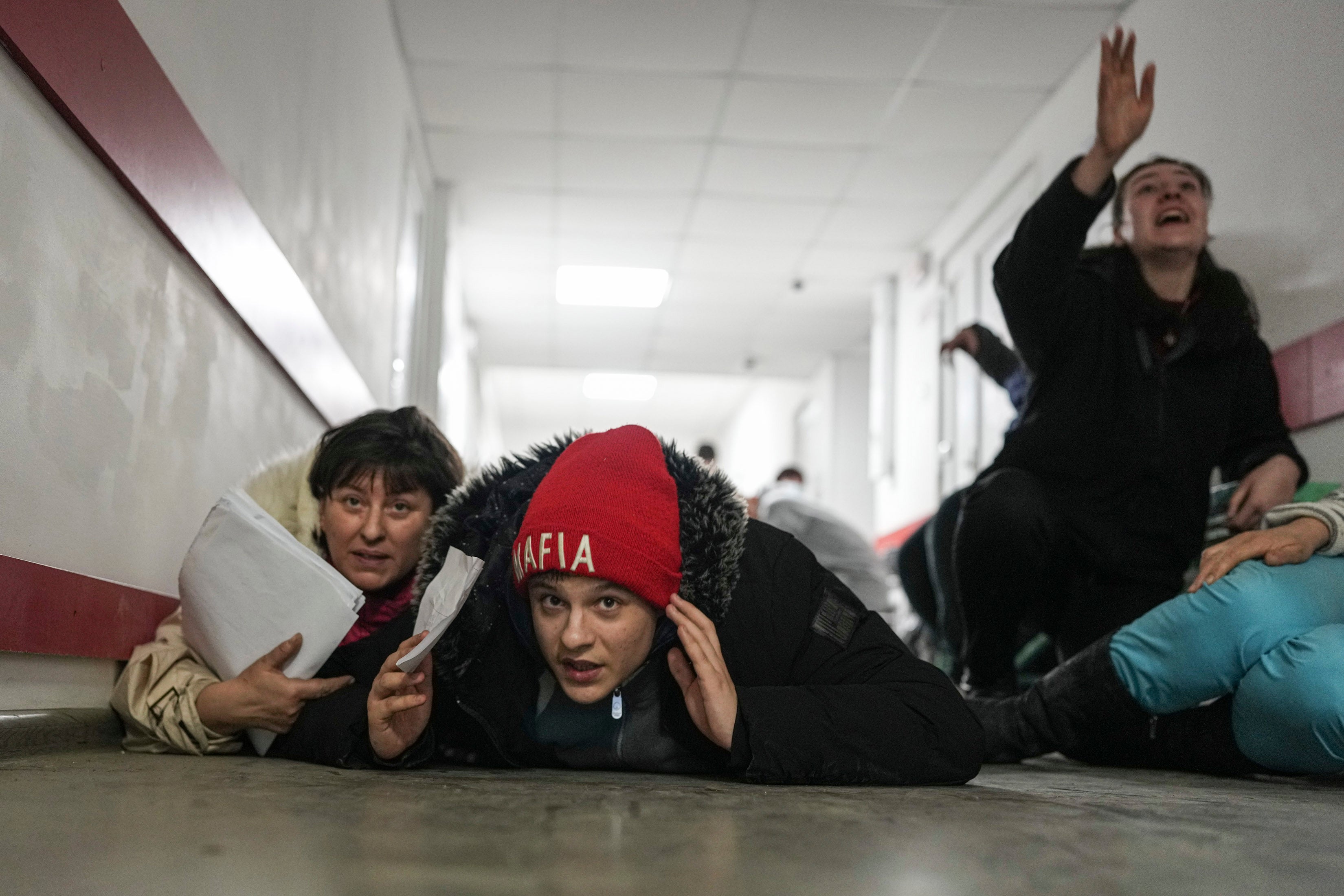 People lie on the floor of a hospital during shelling by Russian forces in Mariupol, 4 March 2022