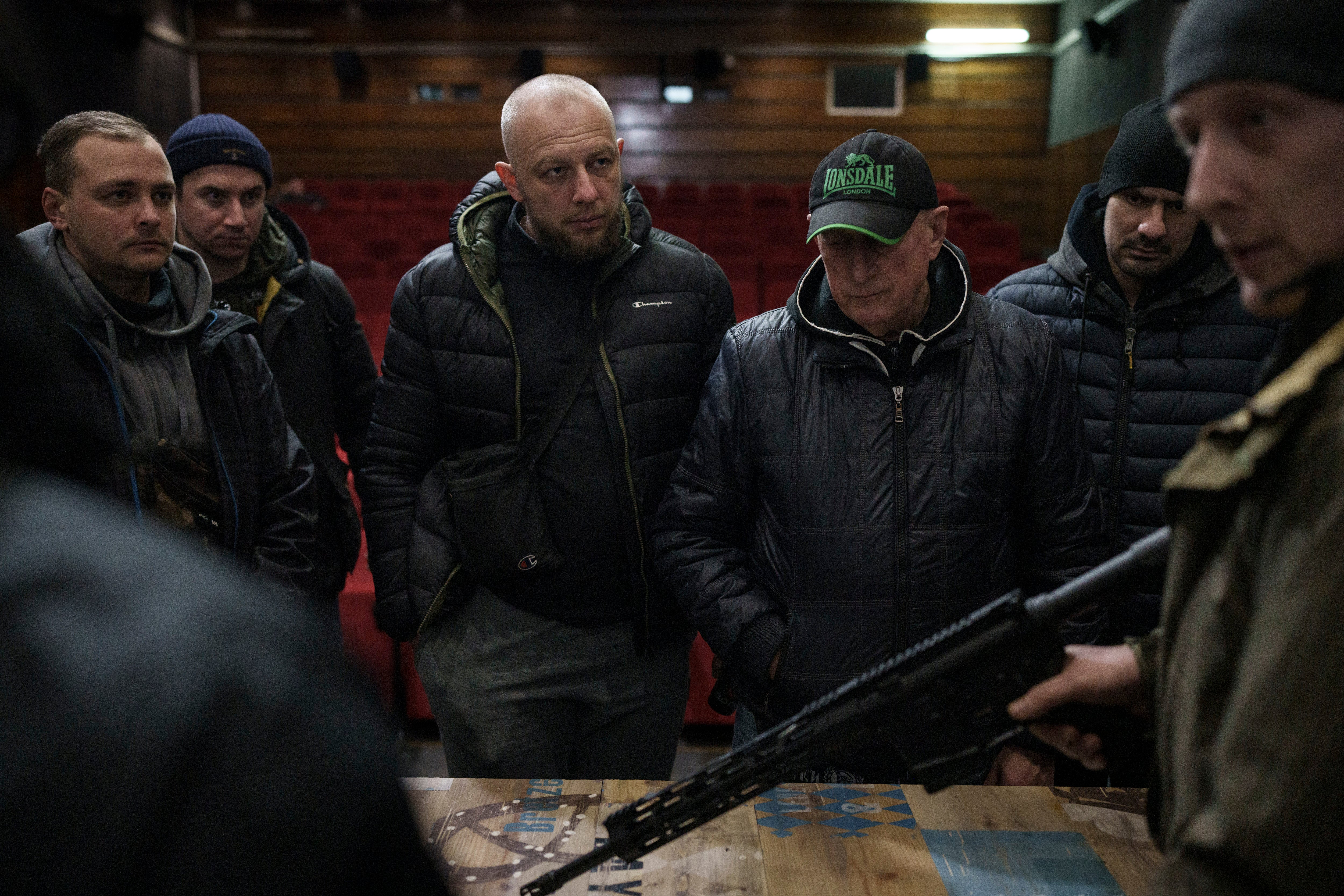 Ukrainian civilians receive weapons training inside a cinema in Lviv, 5 March 2022