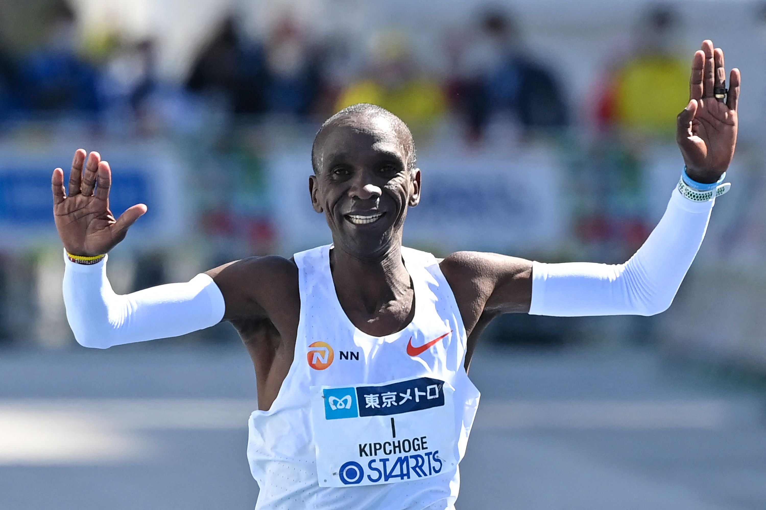 Kenya's Eliud Kipchoge crosses the finish line to win the men's category in the Tokyo Marathon