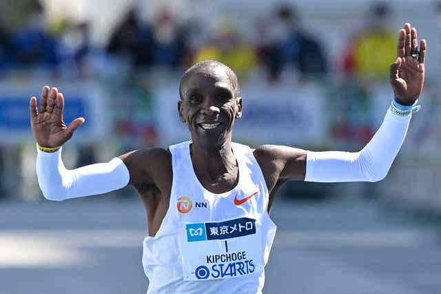 <p>Kenya's Eliud Kipchoge crosses the finish line to win the men's category in the Tokyo Marathon</p>