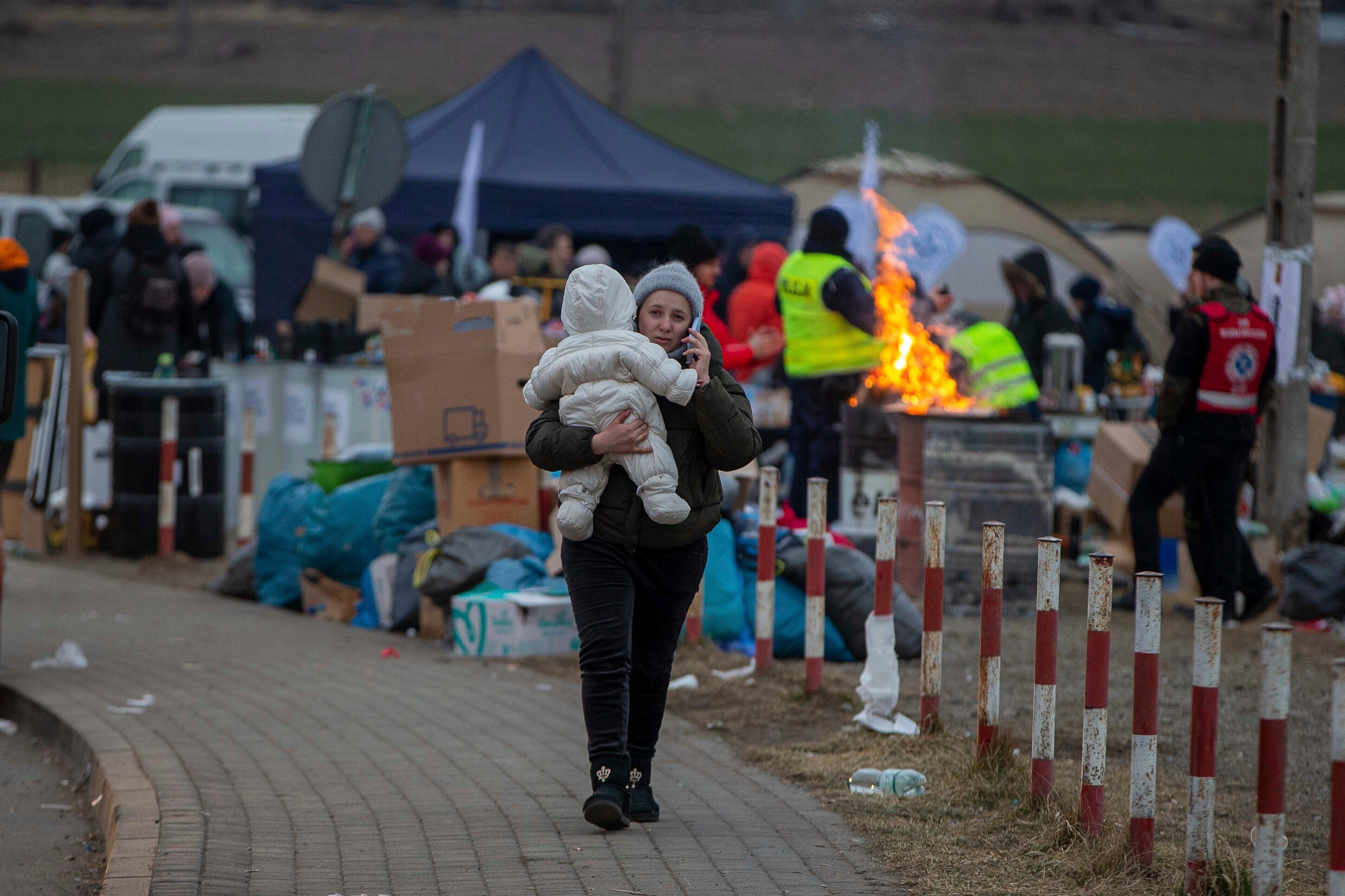 Refugees, mostly women with children, arrive at the border crossing in Medyka, Poland (Visar Kryeziu/AP)
