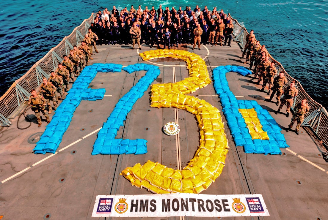 The crew of HMS Montrose with the captured 6.5 tonnes of hashish (MoD/Crown copyright/PA)