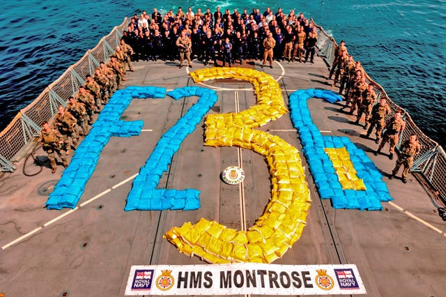 The crew of HMS Montrose with the captured 6.5 tonnes of hashish (MoD/Crown copyright/PA)