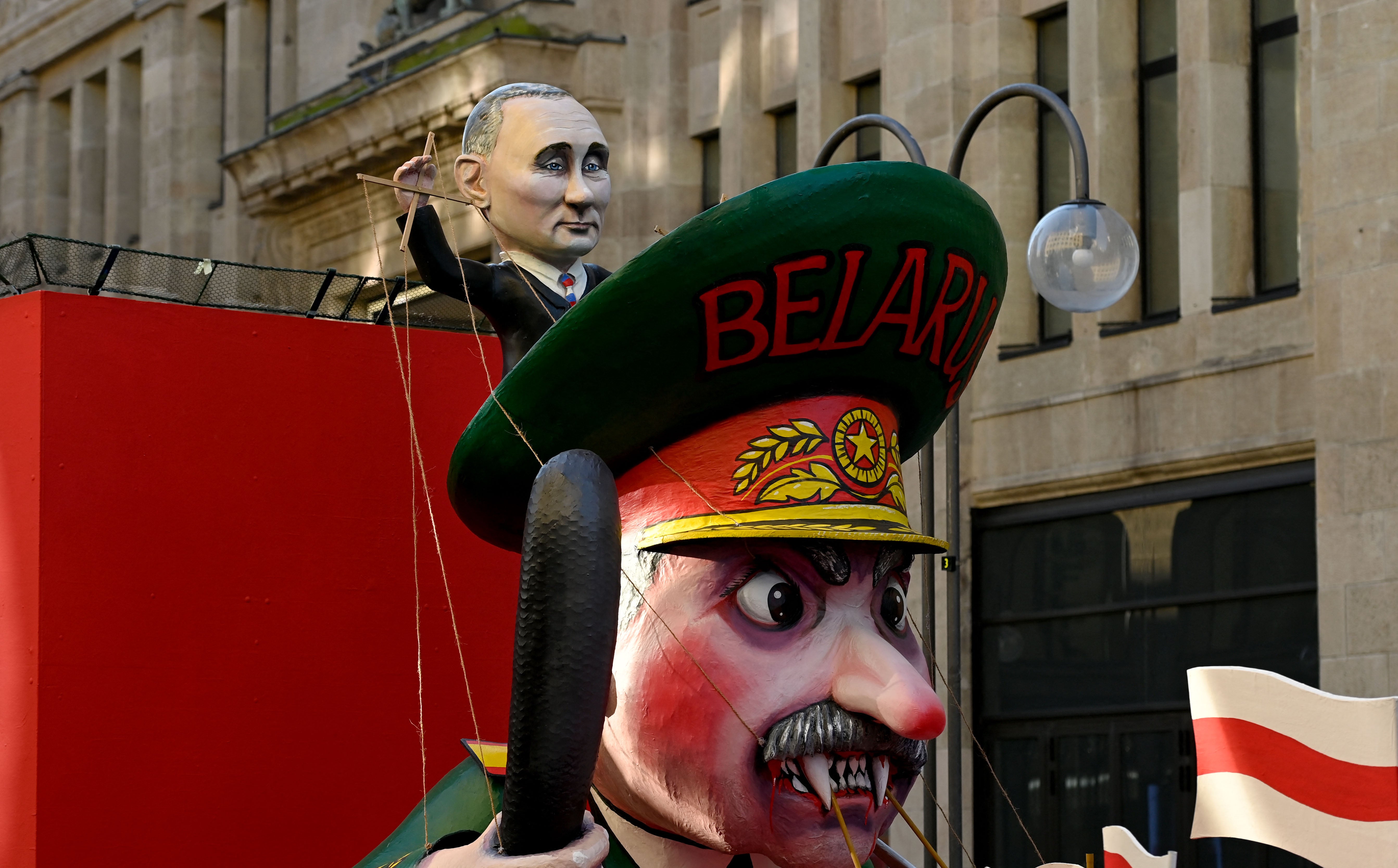 A carnival float featuring Russian President Putin (top) handling Belarus’s President Lukashenko like a puppet at a peace march, ‘Freedom for Ukraine’, in Cologne, Germany in February