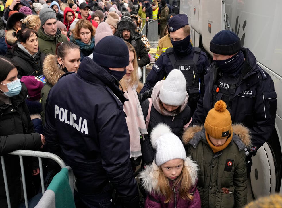Ukrainian refugees are processed at the Korczowa border crossing into Poland (Czarek Sokolowski/AP)