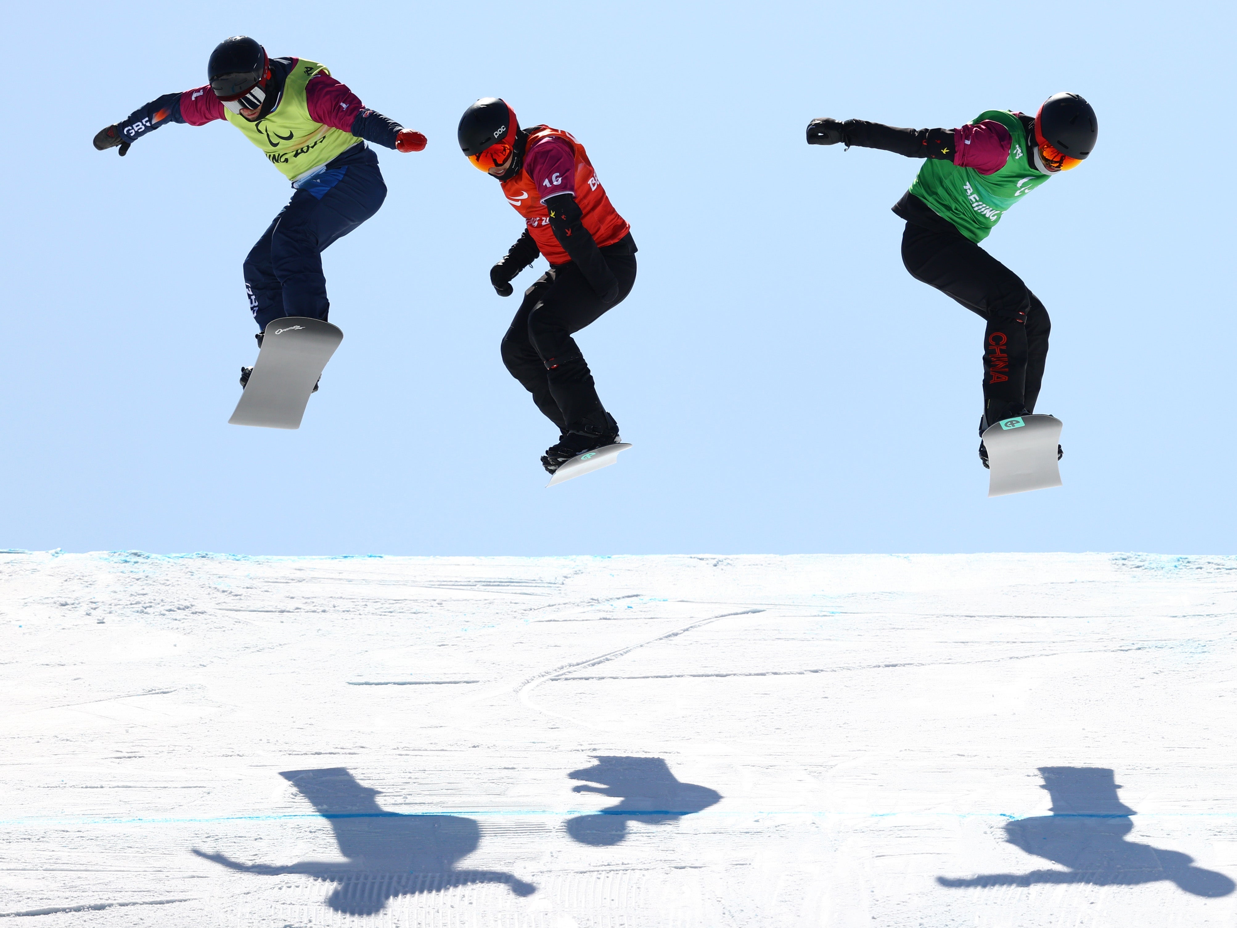 James Barnes-Miller (left) missed out on a snowboard cross medal in Beijing