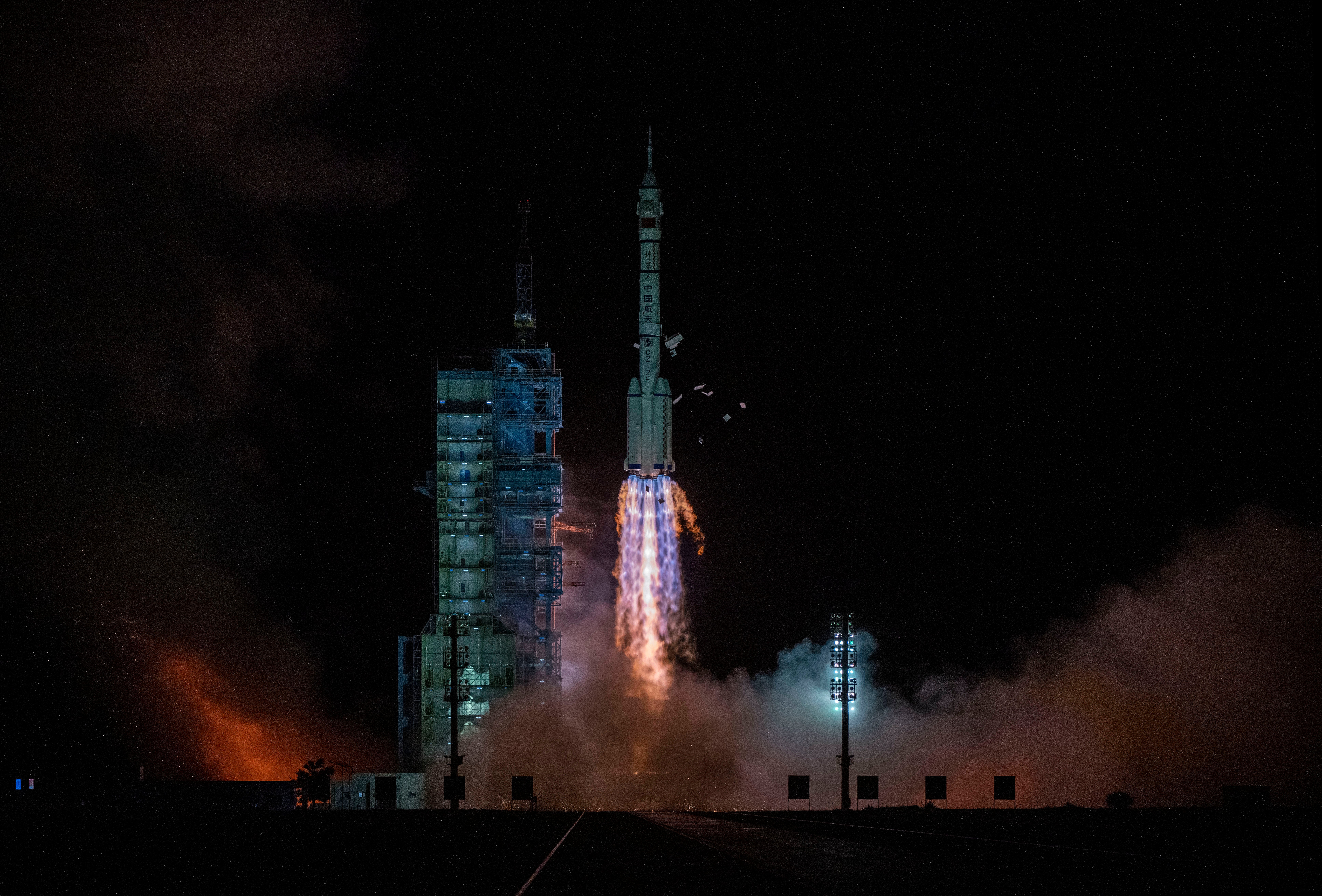 The Shenzhou-13 carried by a Long March-2F rocket launches with three astronauts from China Manned Space Agency on board early on October 16, 2021