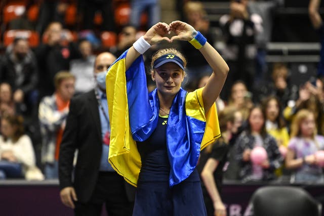 <p>Ukraine’s Dayana Yastremska, wrapped in the Ukrainian national flag</p>