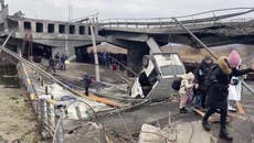 Ukrainians fleeing Kyiv hide under destroyed bridge from Russian airstrikes