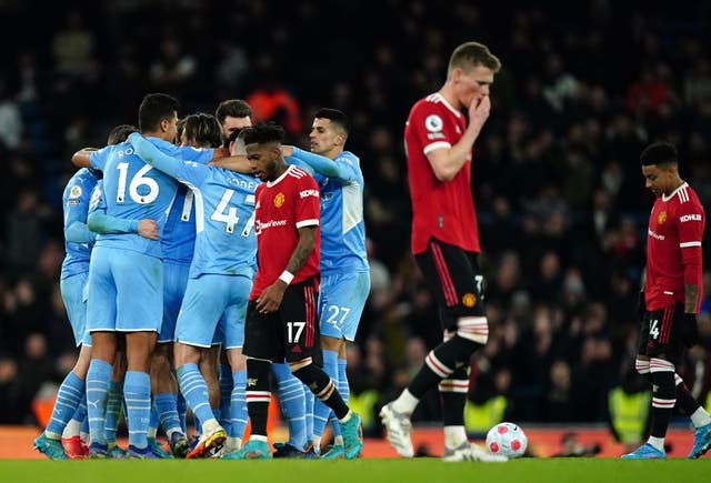 <p>Manchester United’s despair is apparent as Man City celebrate their fourth goal</p>