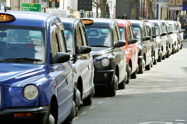 Cabbies in London are queuing at ranks rather than driving in search of passengers because of spiralling diesel costs (Nick Ansell/PA)