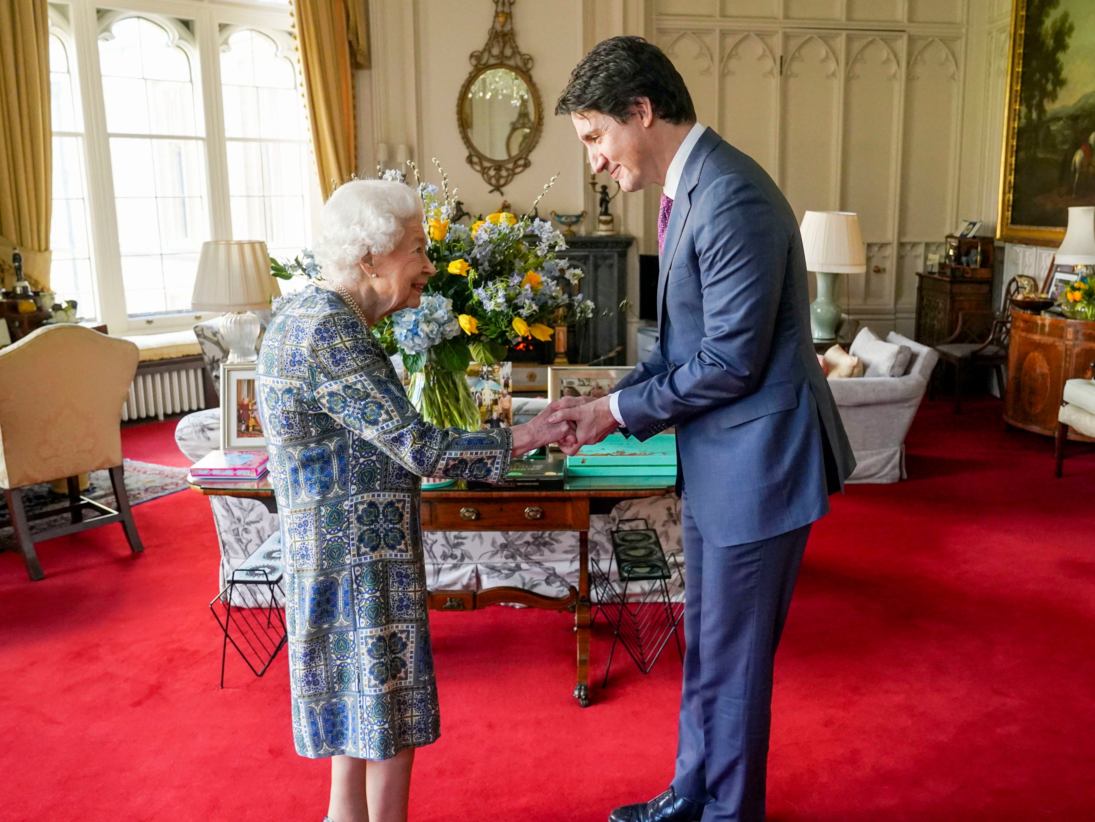 The Queen shakes hands with Canadian Prime Minister Justin Trudeau in Windsor Castle’s Oak Room