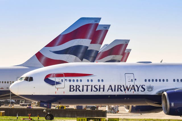 <p>British Airways planes on the tarmac</p>