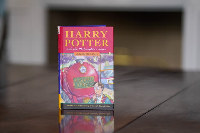 A near-perfect copy of the first edition hardback of JK Rowling’s Harry Potter And The Philosopher’s Stone (Jacob King/PA)