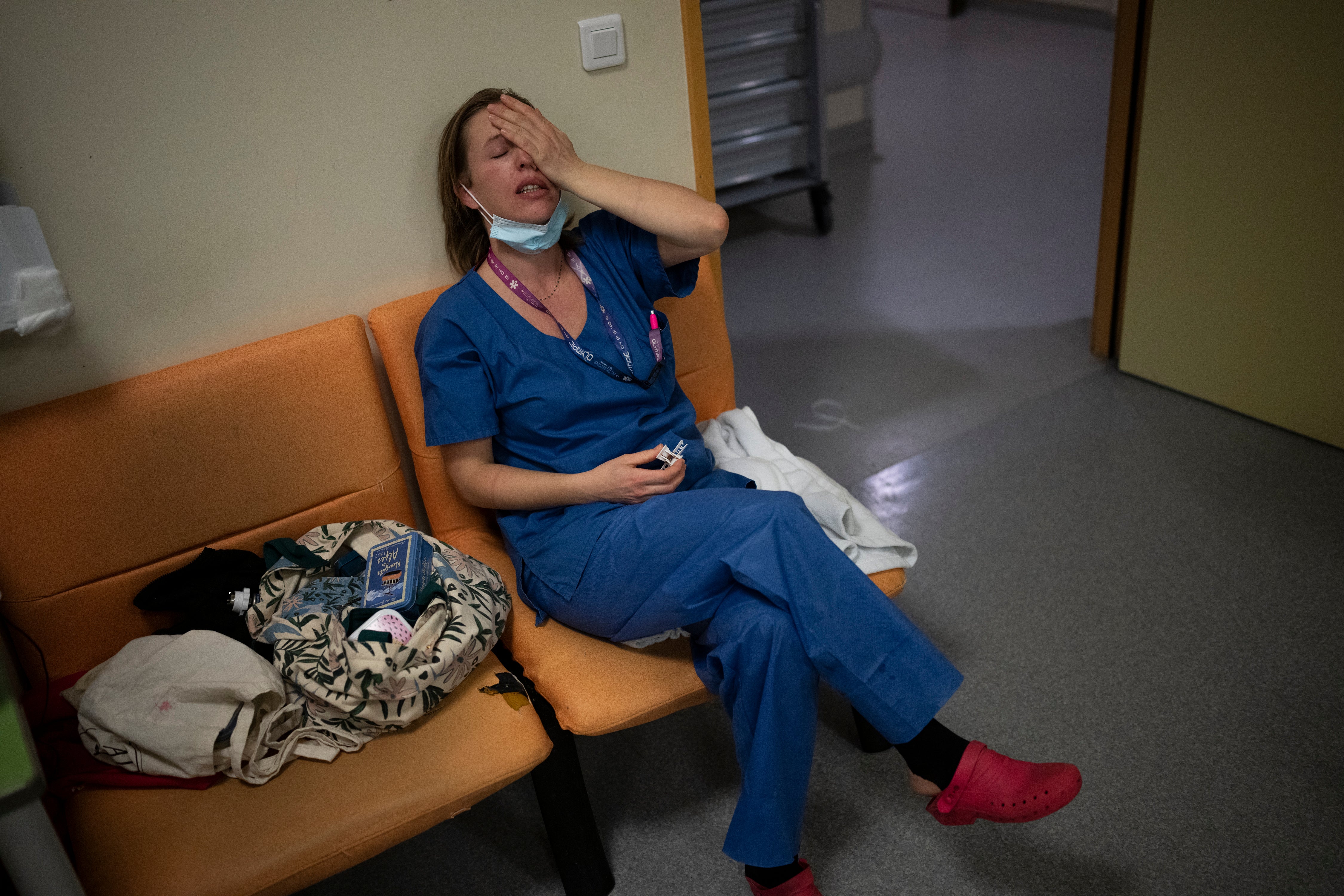 A nurse pauses in the middle of her shift in Marseille, south of France