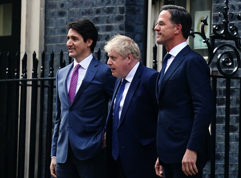 Boris Johnson with Canadian prime minister Justin Trudeau and Dutch prime minister Mark Rutte (Victoria Jones/PA)