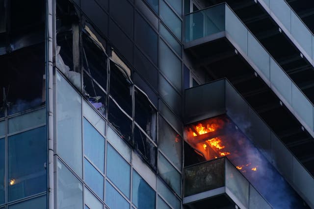 Emergency services attend a fire which has broken out in a block of flats in east London (Victoria Jones/PA)