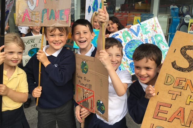 <p>Children on a climate march in Kingston, southwest London </p>