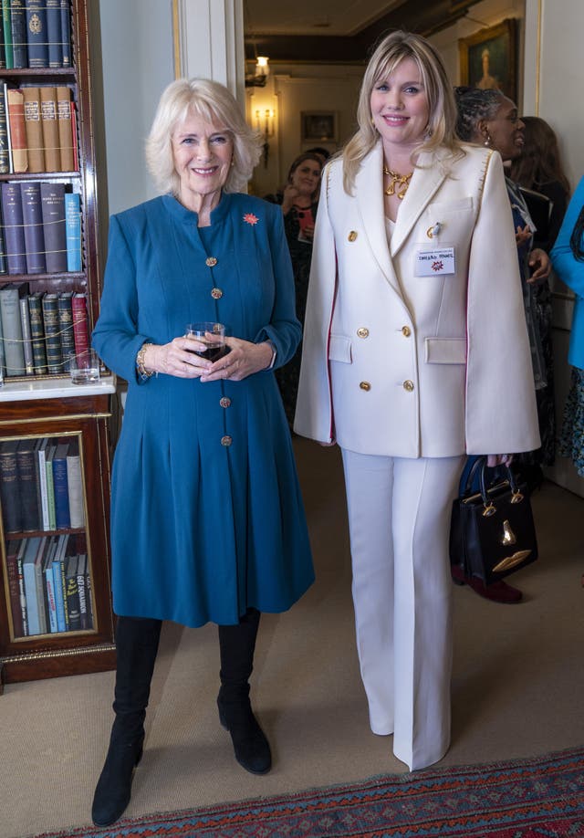 The Duchess of Cornwall speaks to actress Emerald Fennell, who played Camilla in TV’s The Crown, at a Clarence House reception to mark International Women’s Day (Arthur Edwards/The Sun/PA)