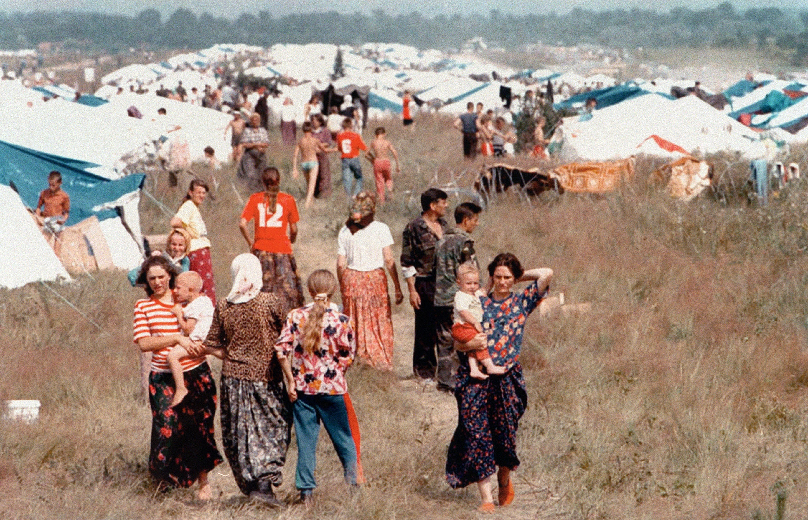 Refugees from the fallen Bosnian ‘safe area’ of Srebrenica, where more than 8,000 Bosniak Muslim men and boys were killed, at a camp set up by the UN in Tuzla, 15 July 1995