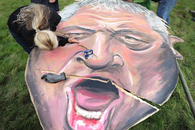 An effigy of former speaker John Bercow, made by the Edenbridge Bonfire Society, being repaired after it ripped (PA)
