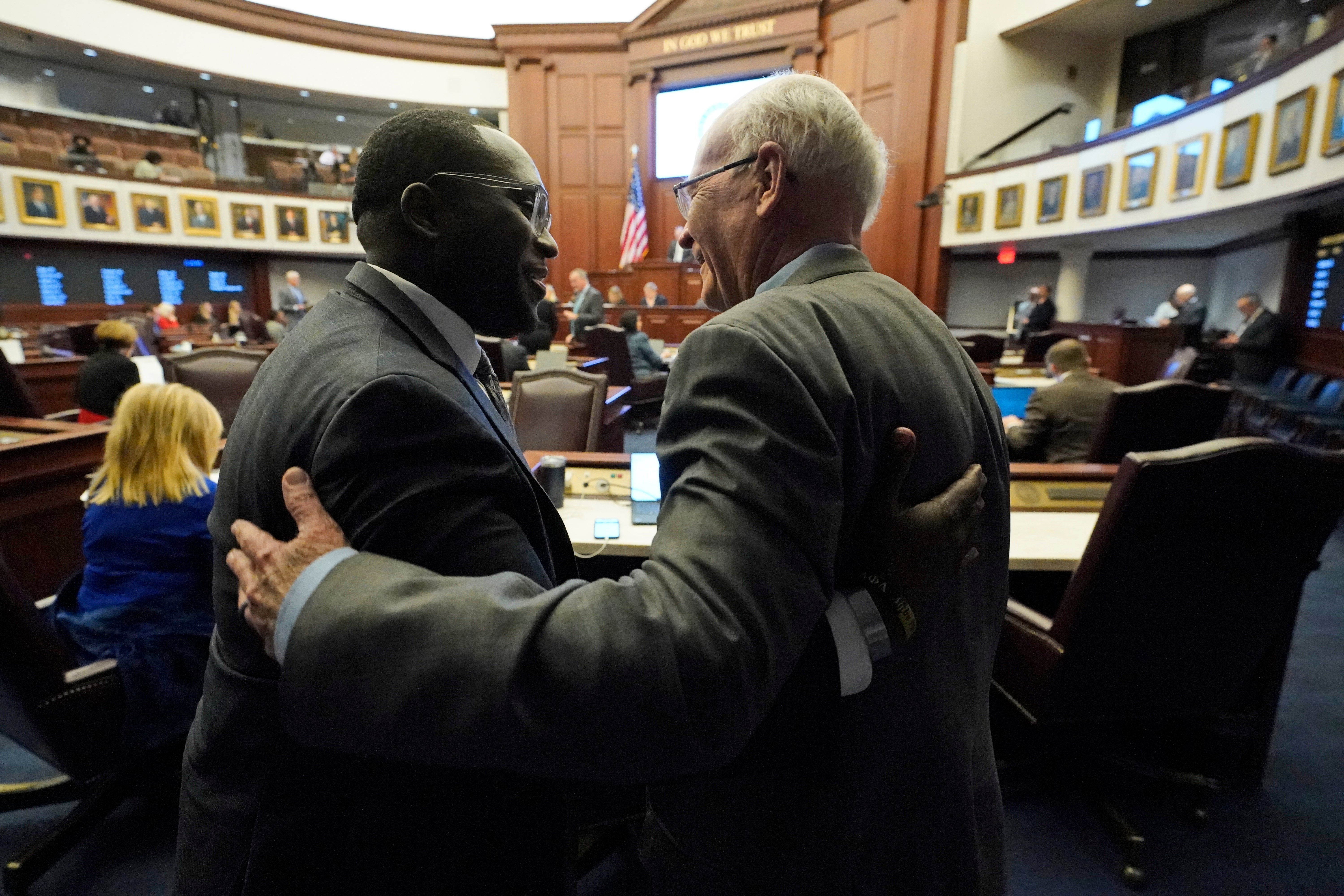 Florida Senator Dennis Baxley, right, the chief sponsor of what opponents call the ‘Don’t Say Gay’ bill, meets with state Senator Shevrin Jones on 8 March.
