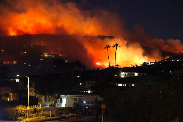 <p>A wildfire burns on 10 February in the Emerald Bay area near Laguna Beach, California</p>