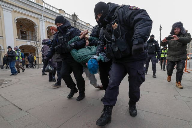 <p>An anti-war demonstrator is detained in St Petersburg, Russia, on 8 March, 2022.</p>