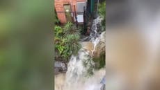 Sydney floods: Dam spills over as intense rainfall hits city