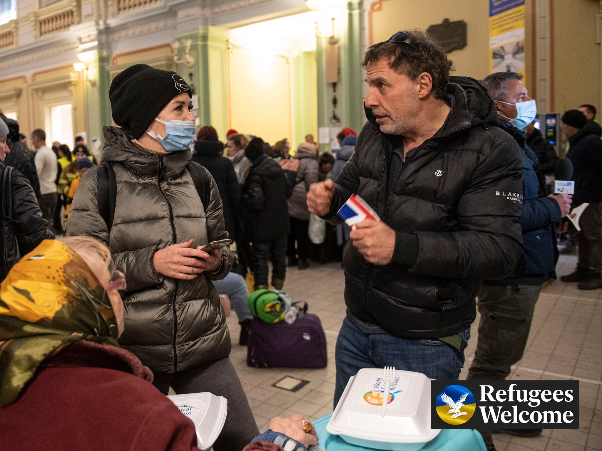Refugees wait at Przemysl train station in Poland to continue their journey onward across Europe