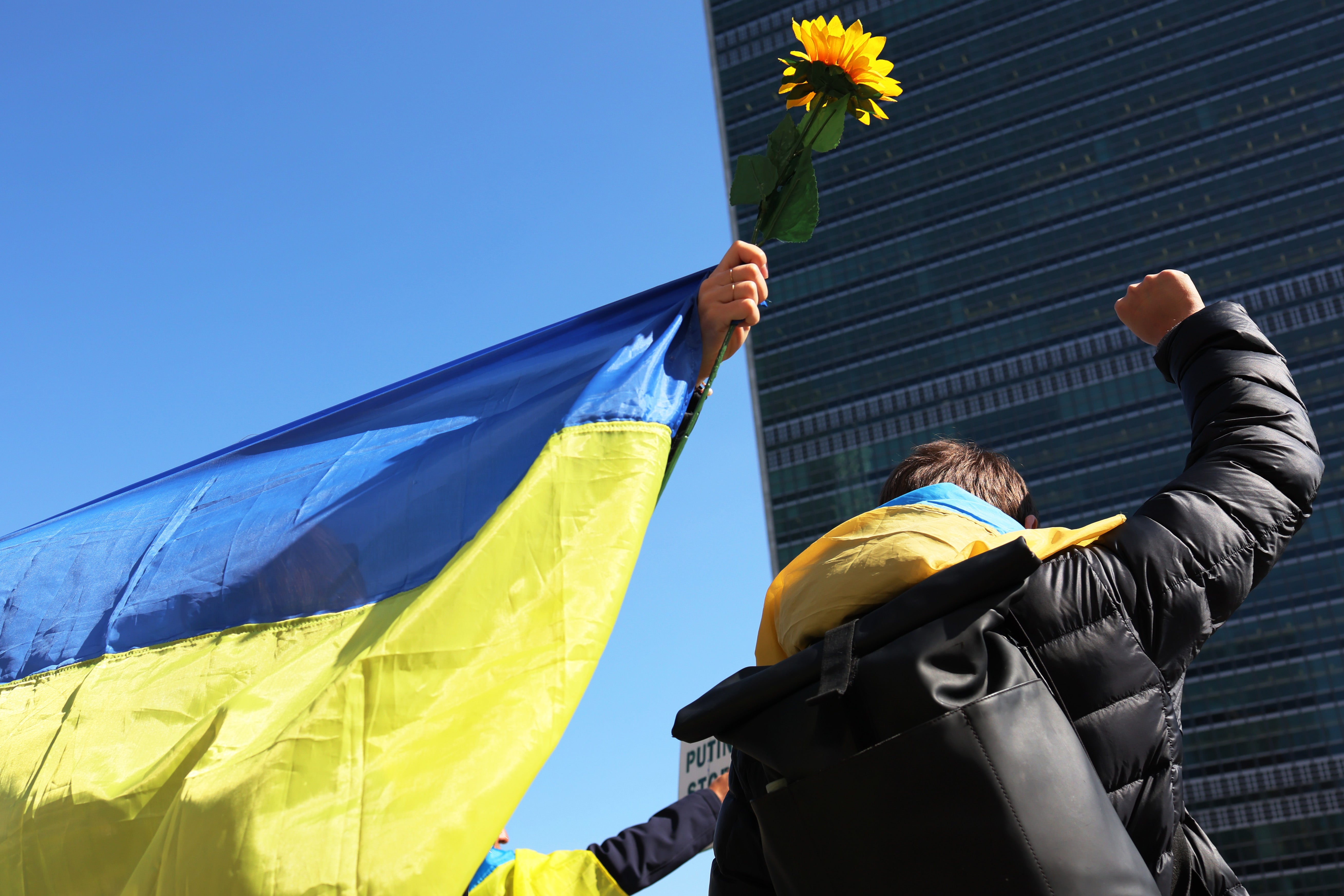 People gather to protest against the war in Ukraine in front of the United Nations headquarters in New York, 2 March 2022