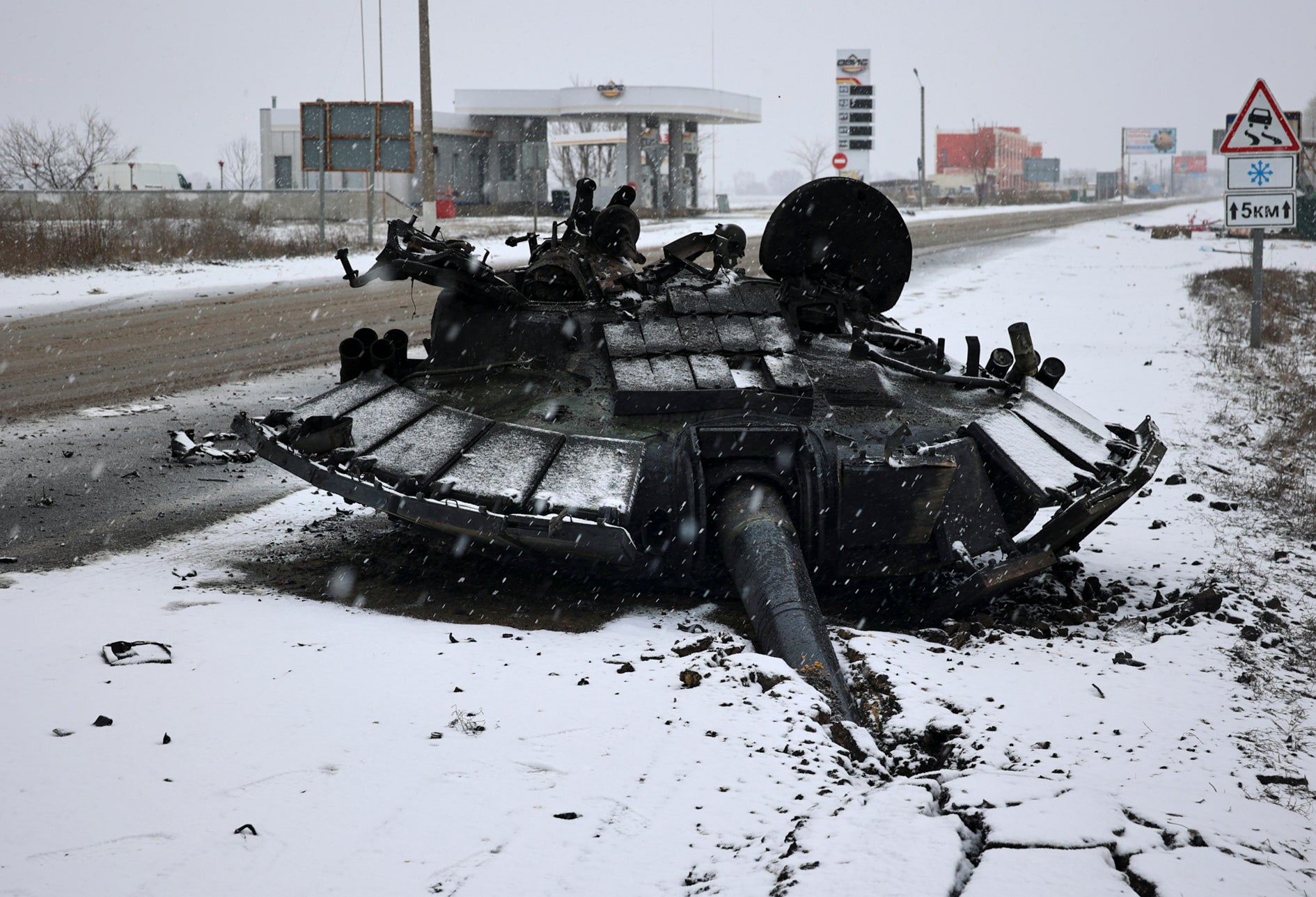 The burnt-out turret of a Russian tank is left abandoned after the Ukrainian army attacked it the previous day near the city of Kharkiv, Ukraine, 25 February 2022