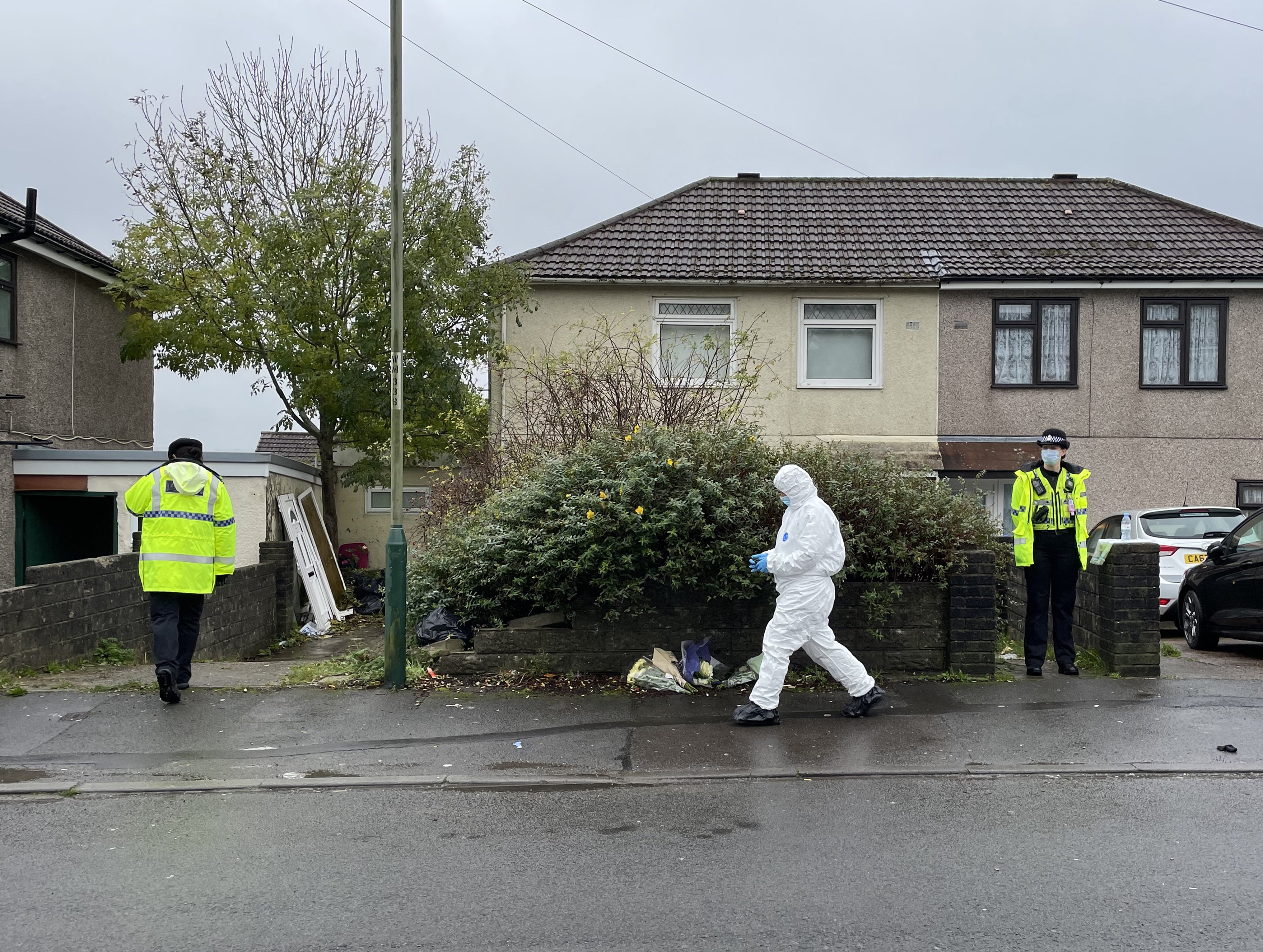 A forensic crime scene investigator outside the house where Jack Lis was killed by a dog (Bronwen Weatherby/PA)