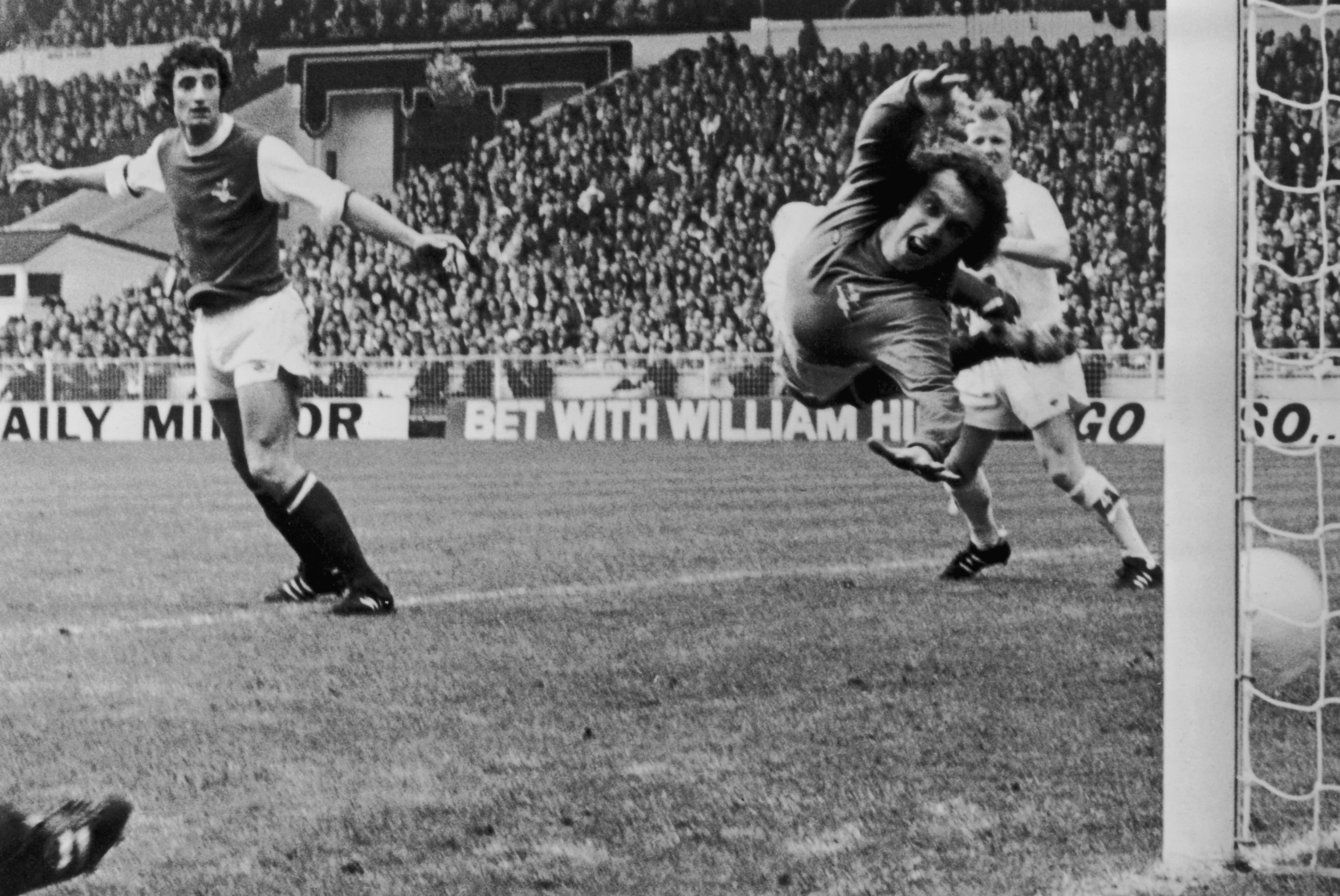 Arsenal goalkeeper Geoff Barnett tries in vain to save Allan Clarke’s header