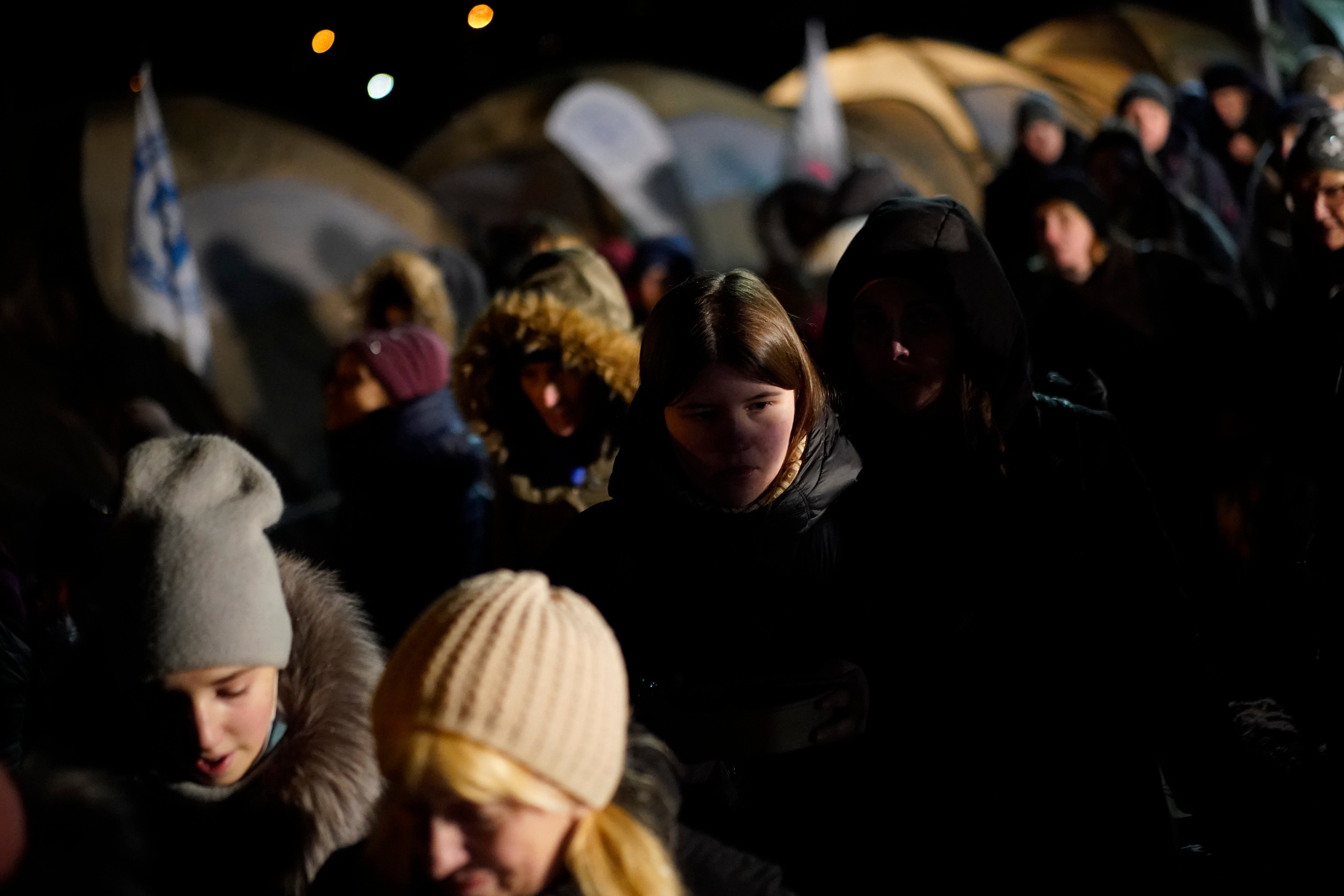 Refugees fleeing war in neighbouring Ukraine walk past tents after crossing to Medyka, Poland, Wednesday, March 9, 202