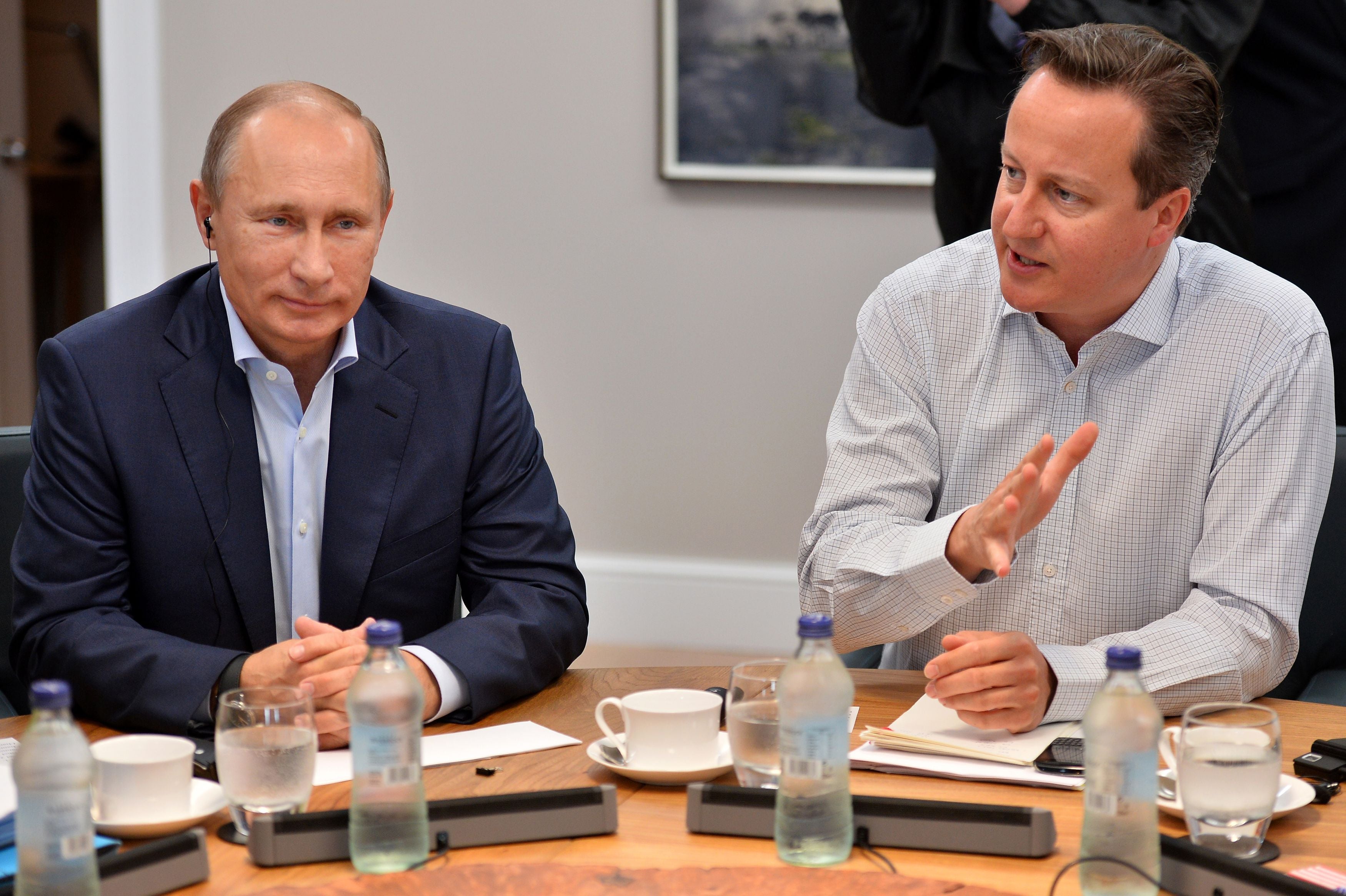 David Cameron and Russian President Vladimir Putin at the second plenary session of the G8 summit in Enniskillen, Northern Ireland in 2013 (Ben Stanstall/PA)