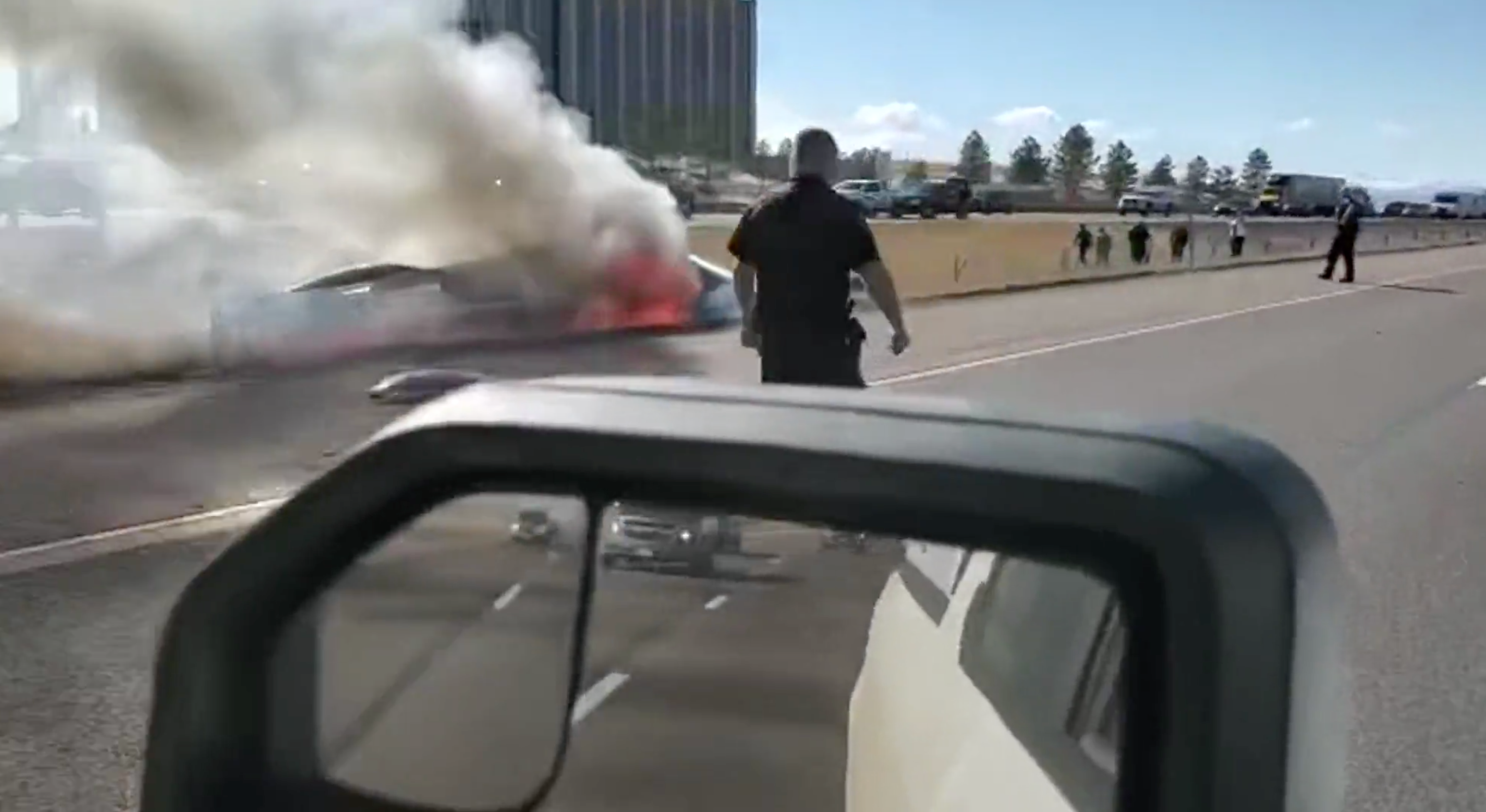 A driver in Colorado filmed the flaming wreckage of a small airplane that crashed into a highway