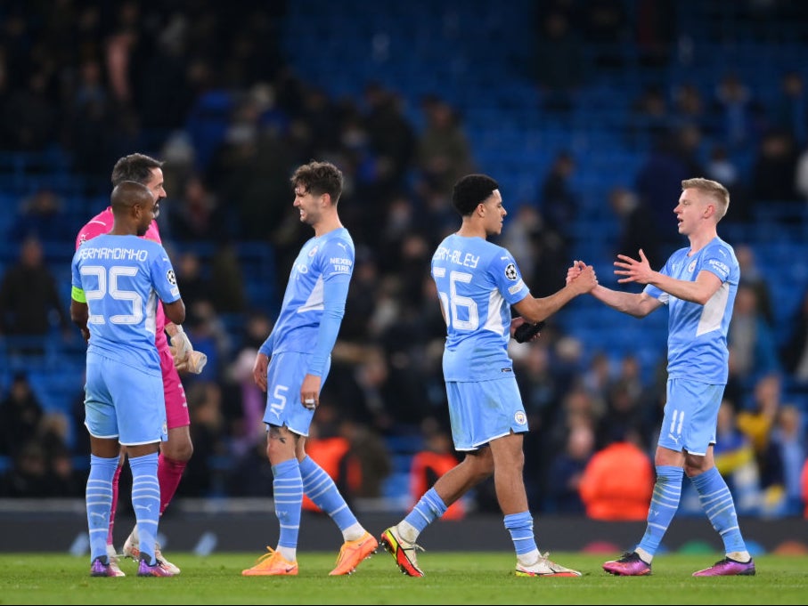 Manchester City’s players celebrate reaching the quarter-finals