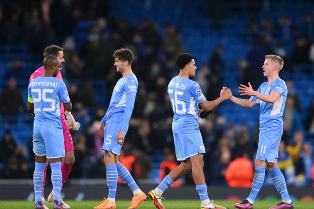 <p>Manchester City’s players celebrate reaching the quarter-finals</p>