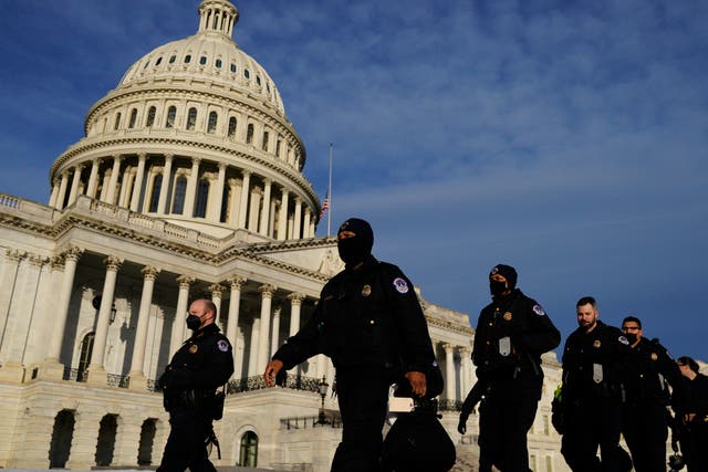 <p>Police officers outside the US Capitol</p>