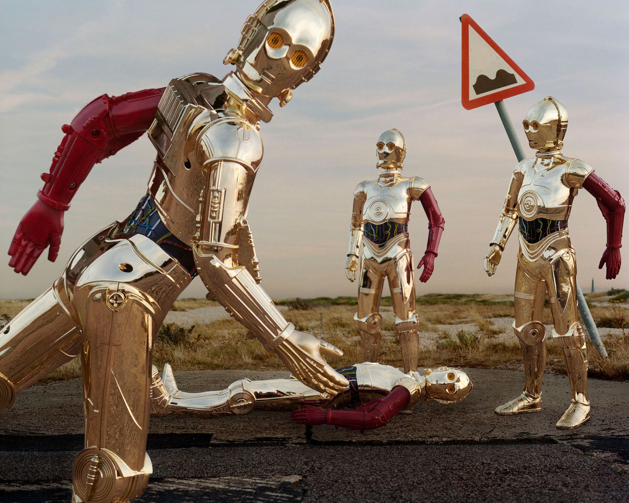 A group of cosplayers as C-3PO