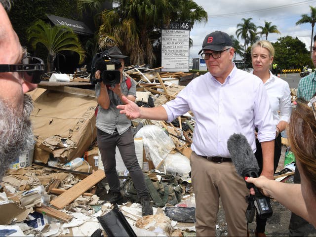 <p>Australian prime minister Scott Morrison inspecting flood damage in the suburb of Brisbane, Queensland,  on 10 March 2022</p>