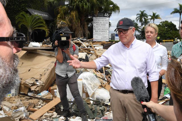 <p>Australian prime minister Scott Morrison inspecting flood damage in the suburb of Brisbane, Queensland,  on 10 March 2022</p>