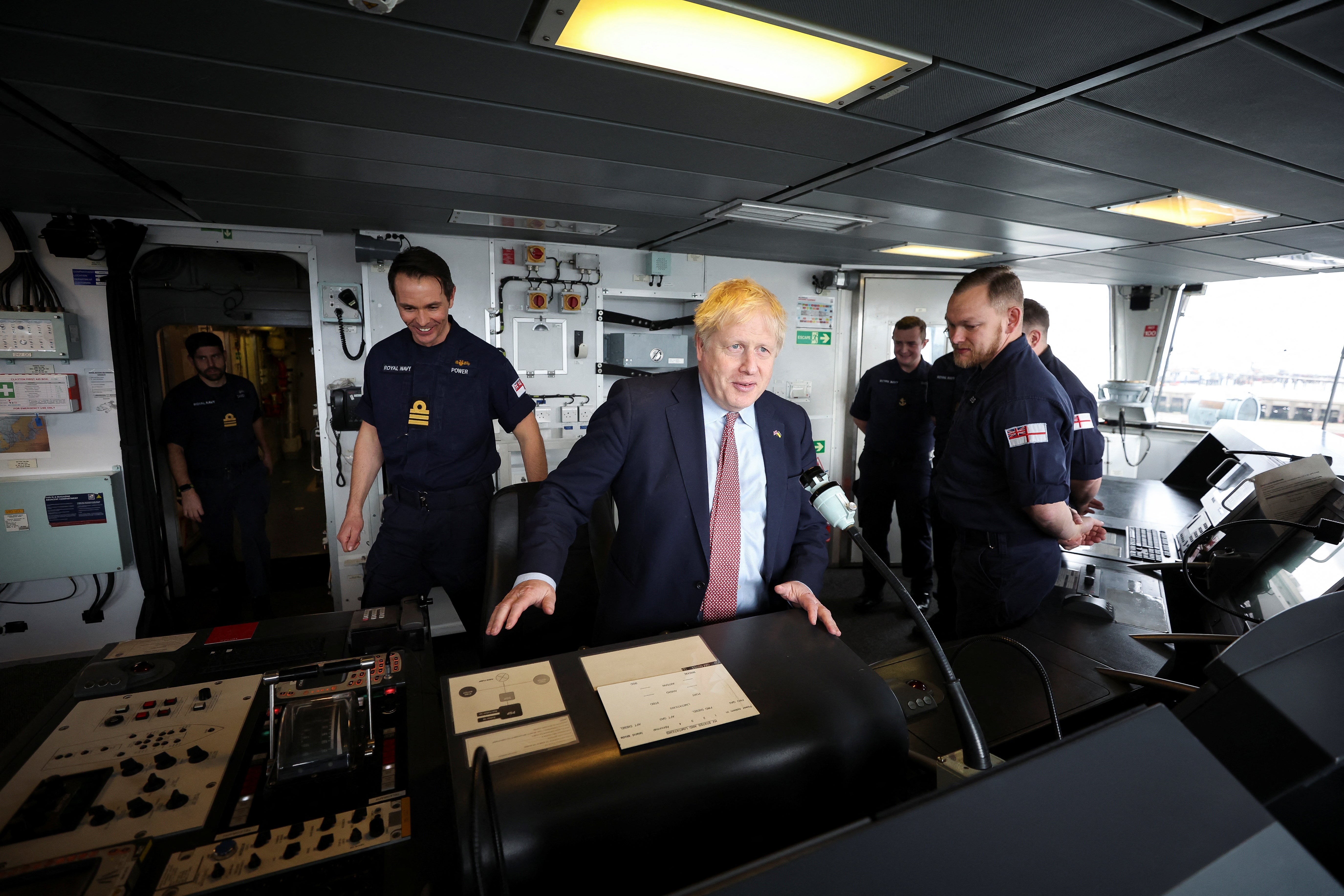 Prime Minister Boris Johnson sits on the bridge of a HMS Dauntless, which has been undergoing a refit (Phil Noble/PA)